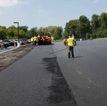Asphalt contractor hand luting an asphalt seam in St Louis